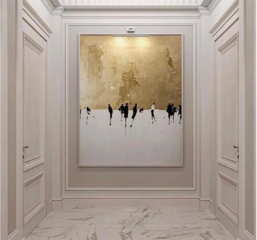 Gold leaf panels lit along a marble corridor
